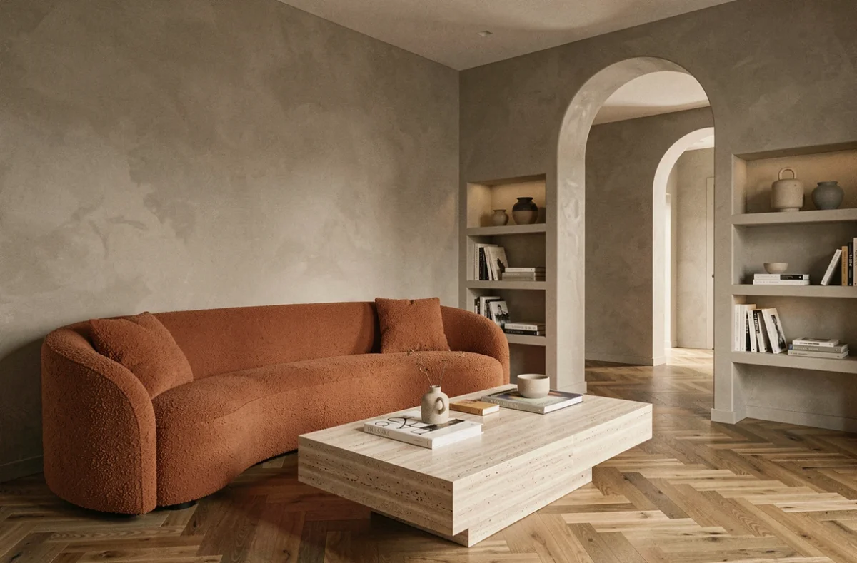 Salon contemporain aménagé par Arcanne Design à Roanne avec canapé bouclé et étagères intégrées